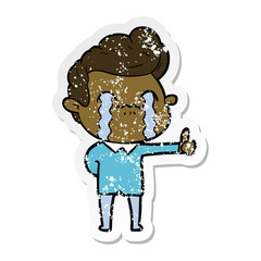 distressed sticker of a cartoon man crying