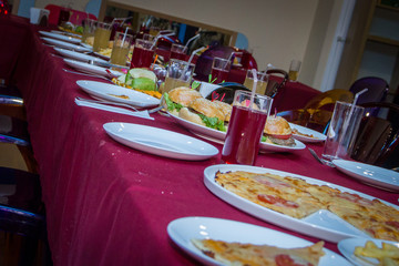 Table with food, snacks and beverages at the kid's birthday party celebration