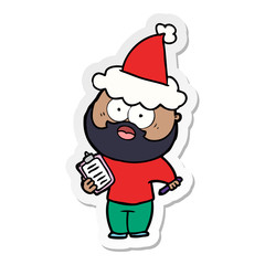 sticker cartoon of a bearded man with clipboard and pen wearing santa hat