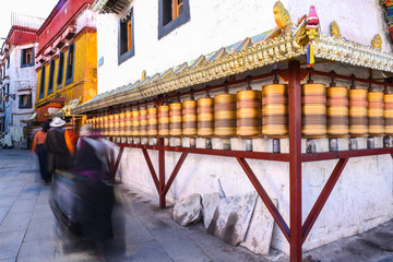 Prayer wheels in Jokhang temple. The characters (in Newari language & Tibetan) on the wheels are...