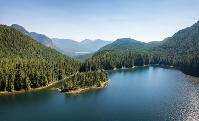 Fototapeta na wymiar Aerial view of a beautiful Canadian Landscape during a sunny summer day. Taken in Kenyon Lake, located near Mission, East of Vancouver, BC, Canada.