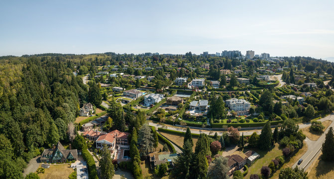 Aerial view of a modern city during a sunny summer day. Taken in Vancouver, BC, Canada.