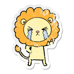 distressed sticker of a cartoon crying lion