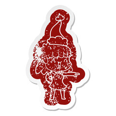cartoon distressed sticker of a happy girl wearing santa hat