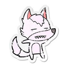 distressed sticker of a cartoon wolf showing teeth
