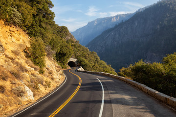 View of a scenic road in the Valley surrounded by mountains. Taken in Yosemite National Park, California, United States.