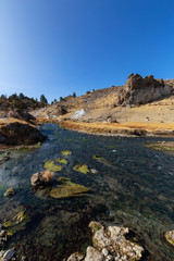 Fototapeta na wymiar View of natural Hot Springs at Hot Creek Geological Site. Located near Mammoth Lakes, California, United States.