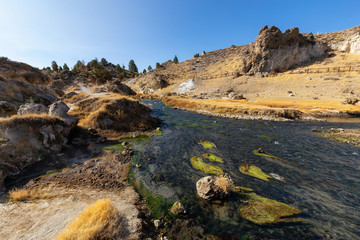 Fototapeta na wymiar View of natural Hot Springs at Hot Creek Geological Site. Located near Mammoth Lakes, California, United States.