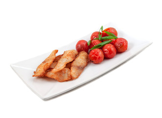 Roast mackerel icefish with grilled tomatoes on a white background