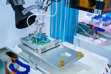 soldering iron tips of robotic system for automatic point soldering for printed and assembly electric circuit board ( PCB ) at factory