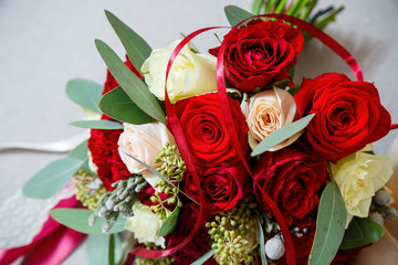 A bouquet of flowers for the bride lies on the windowsill