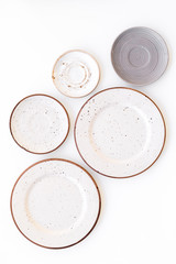 Ceramic plates pattern on white background top view space for text