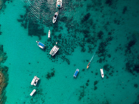 Aerial of cabin cruiser and yacht on the big ocean in Andaman take tourist goto snorkeling point at koh racha yai, Phuket, Thailand