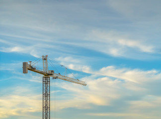 A Tower crane against a beautiful skyscape