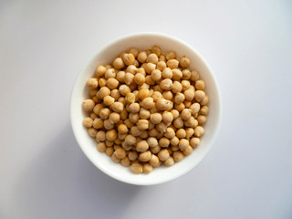 Chikpea beans in a bowl isolated on white