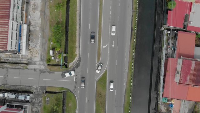 Aerial Drone footage of car moving on surrounding Residential area at Kota Kinabalu, Sabah, Malaysia