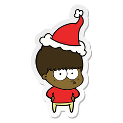 nervous sticker cartoon of a boy wearing santa hat