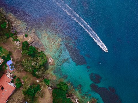 An aerial view of luxury house by the ocean 