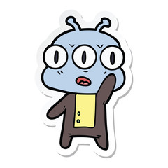 sticker of a cartoon three eyed alien waving