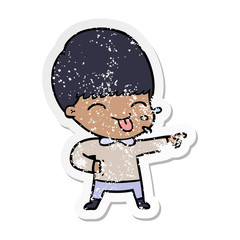 distressed sticker of a cartoon boy sticking out tongue