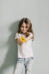 little beautiful girl with yellow tulip