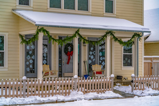 Facade of home with Christmas decoration in winter - Powered by Adobe