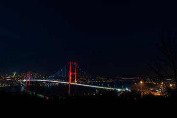 Fototapeta na wymiar Fatih Sultan Mehmet Bridge (also called the Second Bosphorus Bridge) over the Bosphorus strait in Istanbul, Turkey. Built in 1988 and connecting Europe and Asia