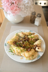 traditional Russian dish dumplings with potatoes bacon and fried onions