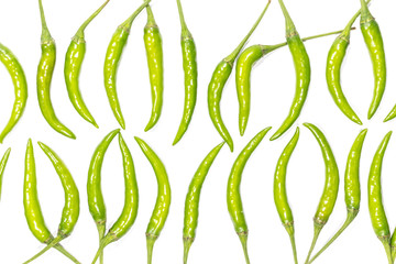 Fresh green chili pepper is a row pattern isolated on white background.