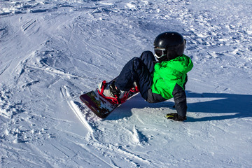 Fototapeta na wymiar Kid on snowboard in winter sunset nature. Sport photo with edit space