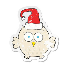 retro distressed sticker of a cartoon owl wearing christmas hat