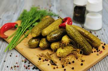 Pickled green cucumbers heap in the bowl