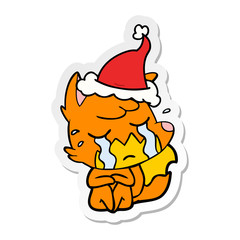 crying fox sticker cartoon of a wearing santa hat