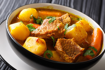 Tasty organic african lamb stew with vegetables close-up in a bowl. horizontal
