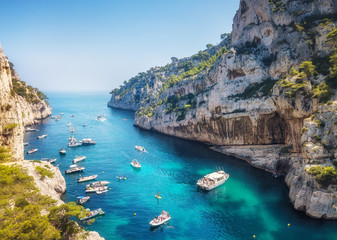 Yachts at the sea in France. Aerial view of luxury floating boat on transparent turquoise water at...