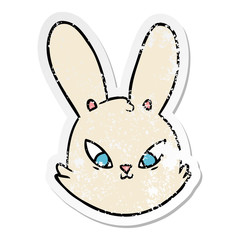 distressed sticker of a cartoon bunny face