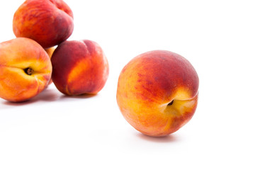 Fototapeta na wymiar Group of ripe peach fruit isolated on white background.
