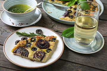 Plate with tasty Italian focaccia on table