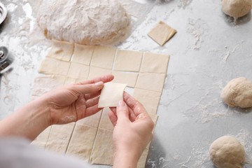 Female baker making cookies in kitchen