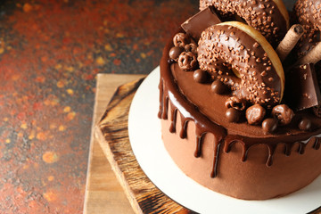 Sweet chocolate cake on table