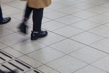 Business people walking in train station blur motion.