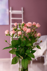 Bouquet of beautiful roses in room