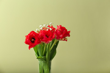 Obraz premium Bouquet of beautiful tulips on color background