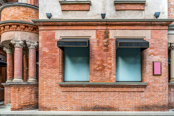 Fototapeta na wymiar Red brick walls and doors and windows in European architecture..
