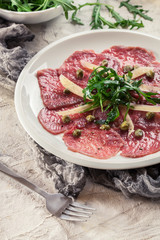 Beef carpaccio with arugula and parmesan