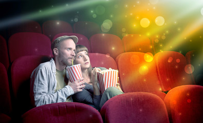 Fanciful couple watching miraculous part of a movie