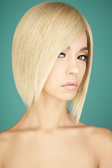 Lovely asian woman with blonde short hair