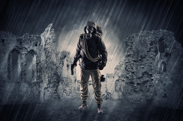 Fototapeta premium Hazard, menace man in a ruined crumbly building with arms on his hand 