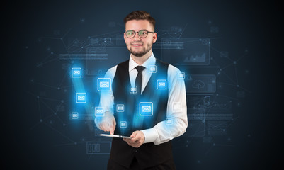 Mailing concept on a tablet with spectacled businessman on the background
