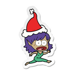 sticker cartoon of a shocked elf girl wearing santa hat